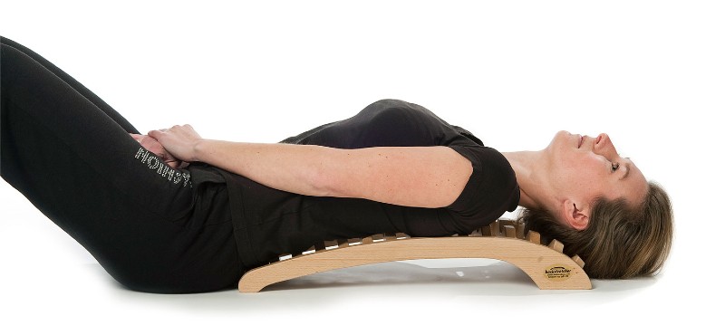 Woman using the Original Backstretcher