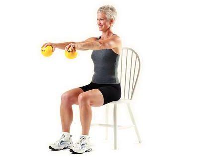 woman using TheraBand soft weights